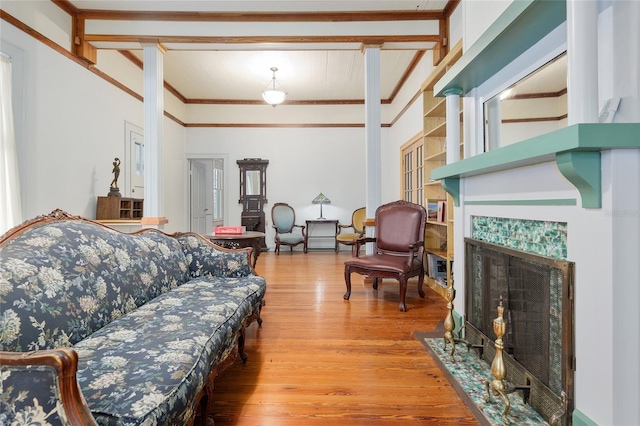 living room with hardwood / wood-style floors and a tile fireplace