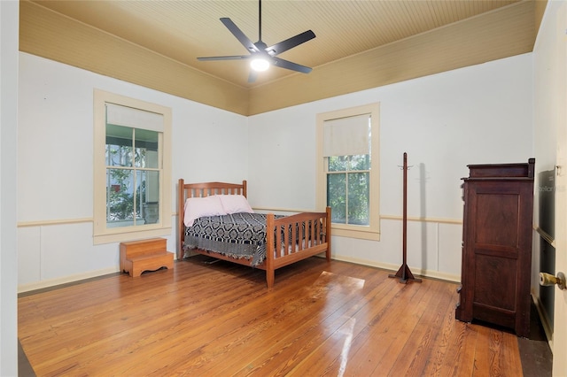 bedroom featuring ceiling fan and light hardwood / wood-style floors