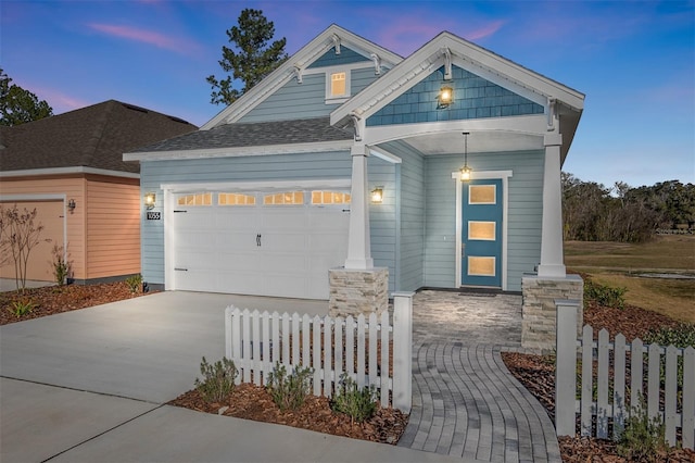 craftsman-style home with a garage