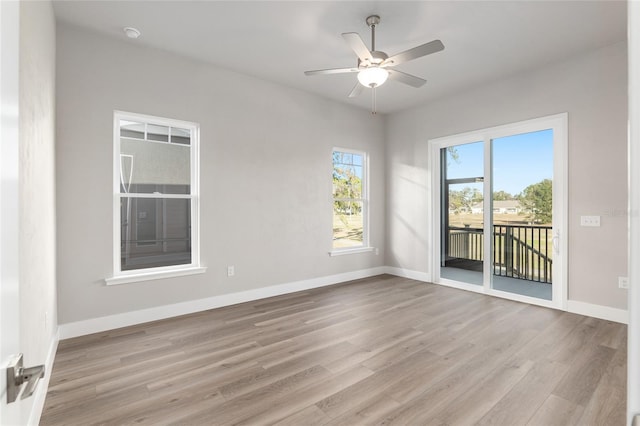 spare room with light hardwood / wood-style floors and ceiling fan