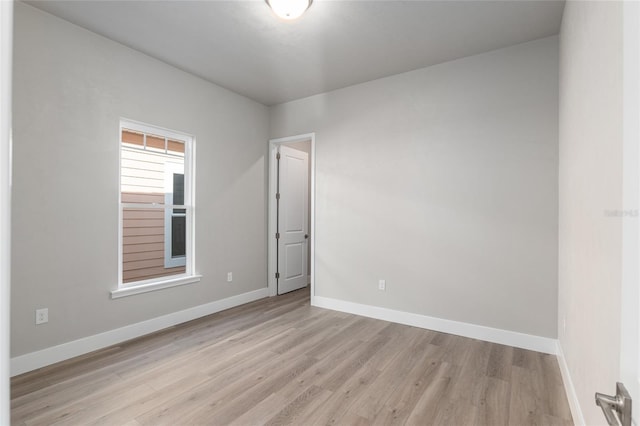 unfurnished room featuring light hardwood / wood-style flooring