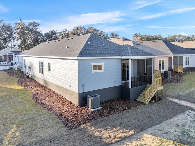 view of home's exterior featuring cooling unit and a sunroom