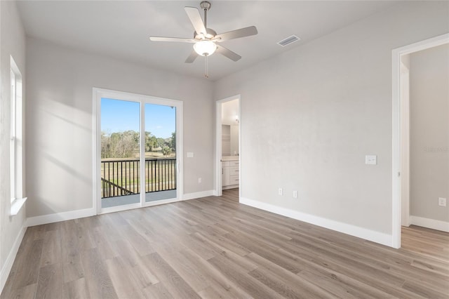 unfurnished room featuring ceiling fan and light hardwood / wood-style flooring