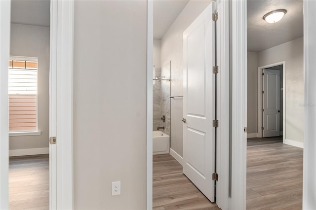 hallway featuring light hardwood / wood-style flooring