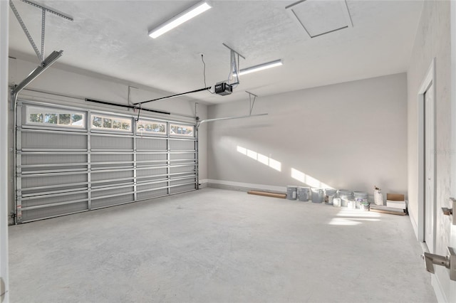 garage featuring a garage door opener