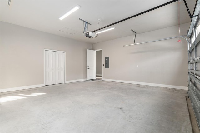 garage featuring a garage door opener and electric panel