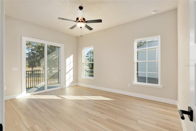 empty room featuring light hardwood / wood-style flooring and ceiling fan