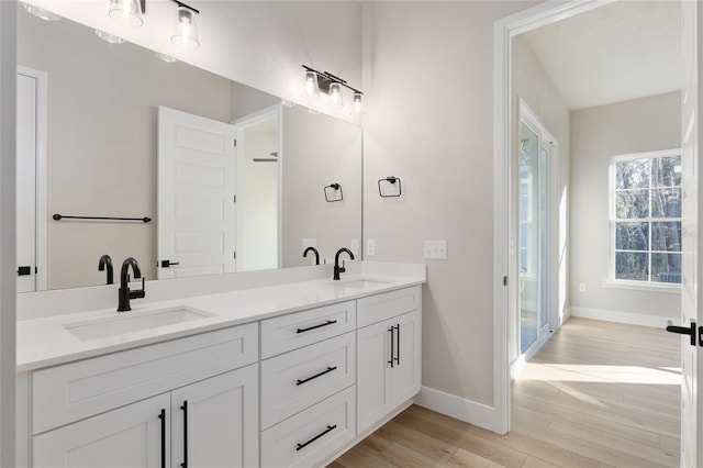 bathroom featuring vanity and wood-type flooring