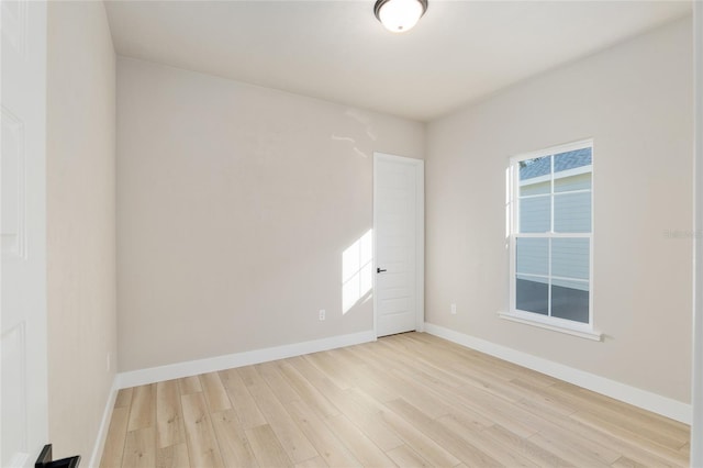 spare room featuring light hardwood / wood-style floors