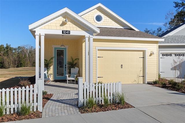 view of front of property with a garage