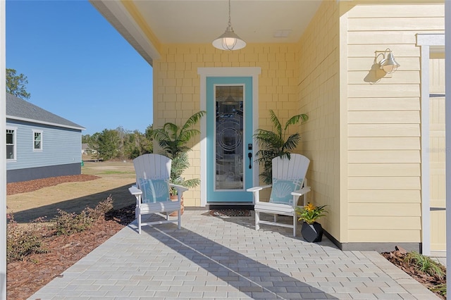 doorway to property with a patio area