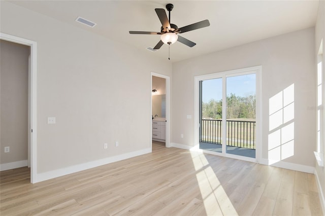 empty room with light hardwood / wood-style floors and ceiling fan