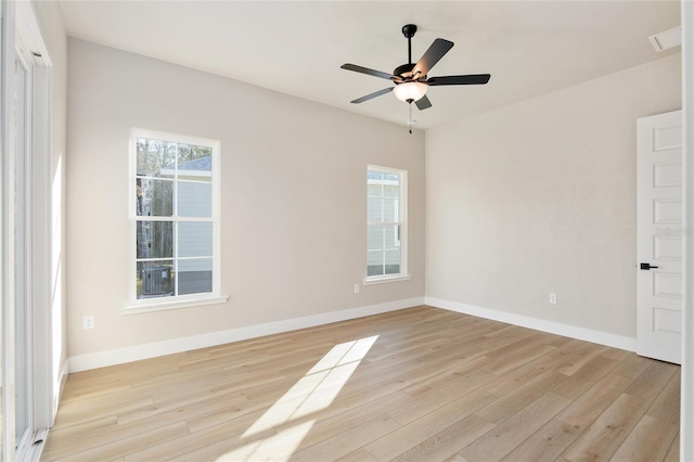 empty room featuring ceiling fan and light hardwood / wood-style floors