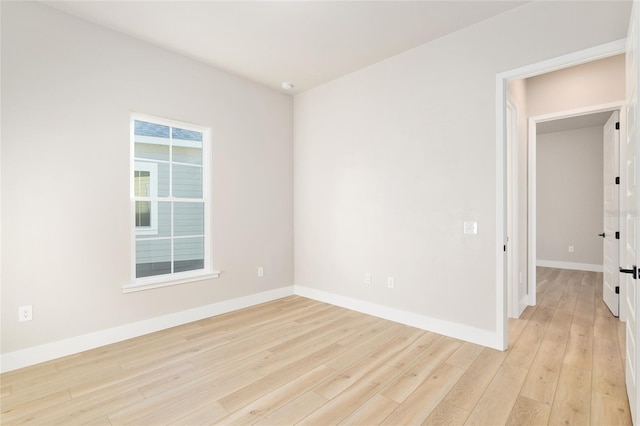 spare room with light hardwood / wood-style floors