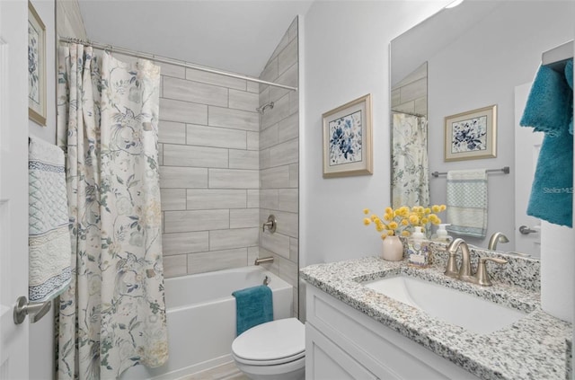 full bathroom featuring toilet, vanity, and shower / bath combo with shower curtain