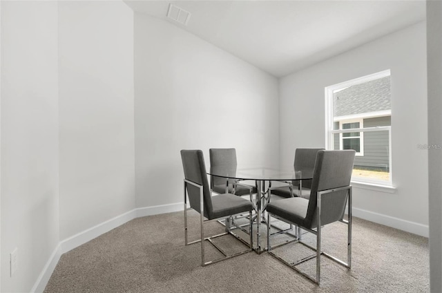 view of carpeted dining area