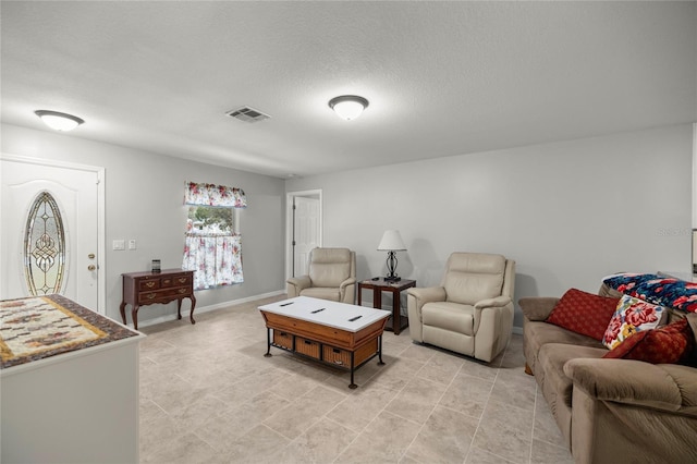 living room featuring a textured ceiling