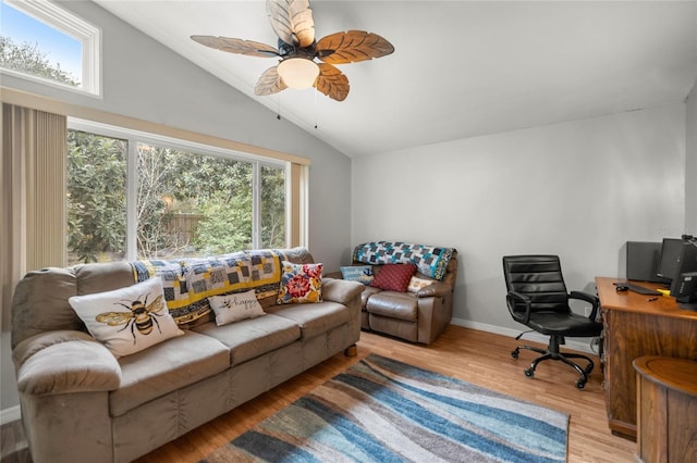 living room featuring light wood-type flooring, ceiling fan, and lofted ceiling