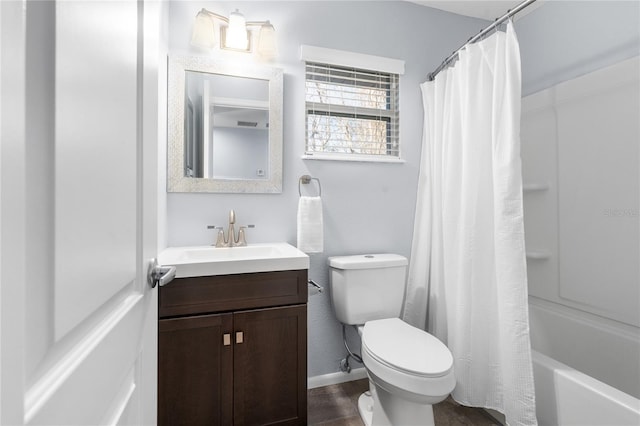 full bathroom featuring toilet, vanity, and shower / tub combo with curtain