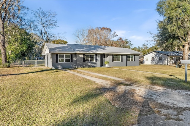 ranch-style home with a front yard