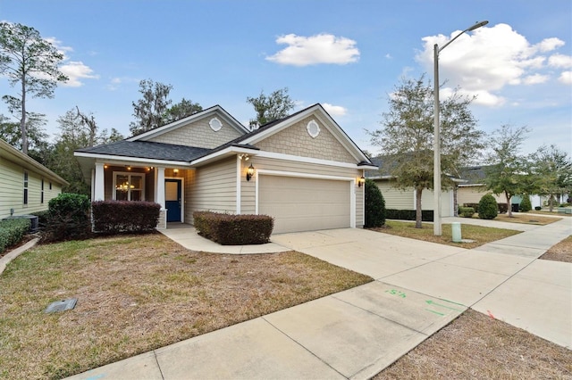 view of front of home with a front lawn and a garage