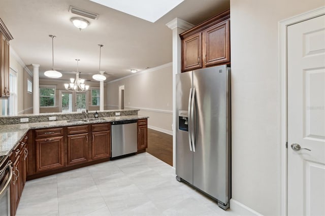 kitchen with stainless steel appliances, a notable chandelier, crown molding, light stone counters, and sink