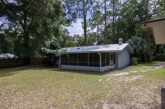 view of yard with a sunroom