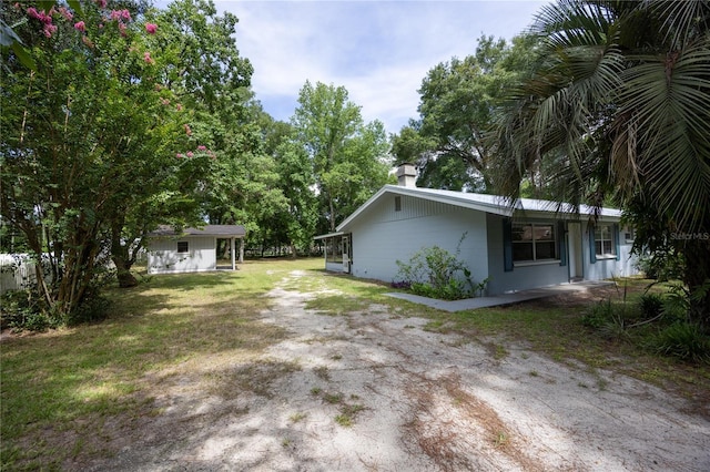 view of home's exterior featuring a lawn