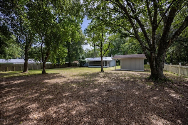 view of yard with a sunroom