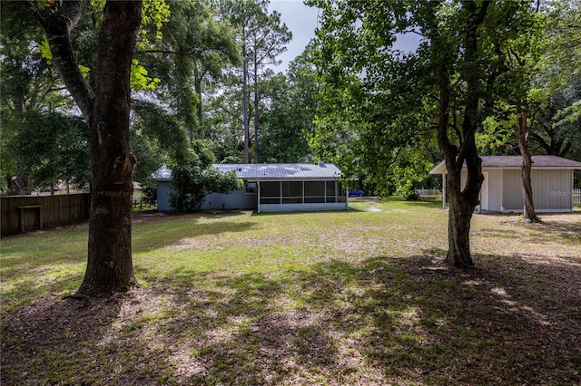 view of yard with a sunroom