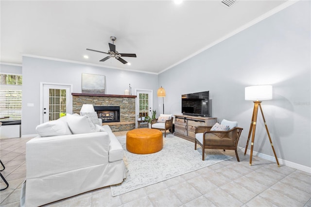 tiled living room with ceiling fan, a fireplace, and crown molding