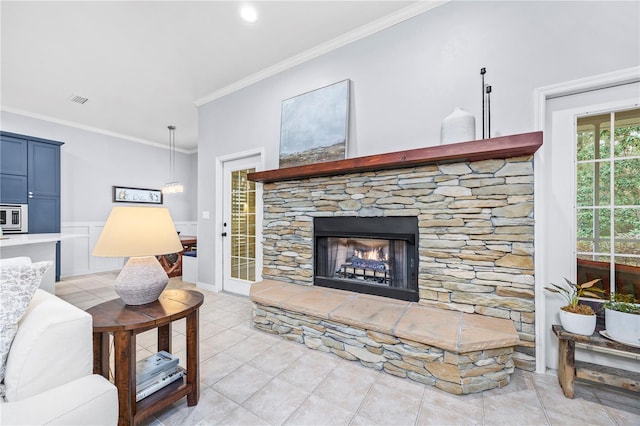 living room featuring a fireplace and crown molding