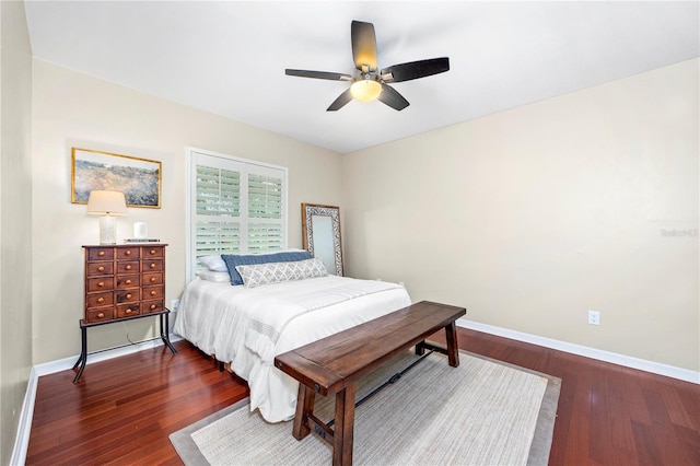 bedroom with ceiling fan and dark hardwood / wood-style flooring