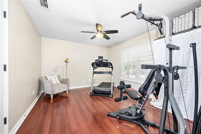 exercise area with ceiling fan and dark hardwood / wood-style floors