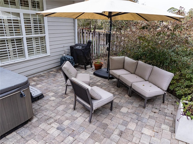 view of patio / terrace featuring a hot tub and outdoor lounge area