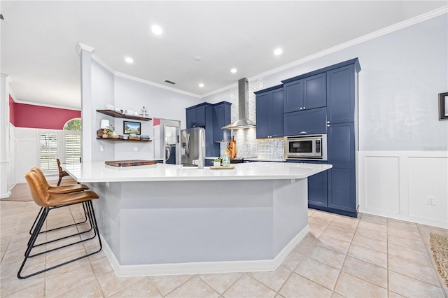 kitchen featuring a kitchen breakfast bar, wall chimney range hood, light tile patterned flooring, and stainless steel appliances