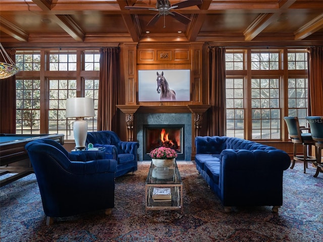 living room with coffered ceiling, ornamental molding, and beamed ceiling