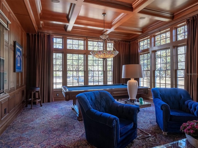 interior space with beam ceiling, coffered ceiling, ornamental molding, wooden ceiling, and wood walls