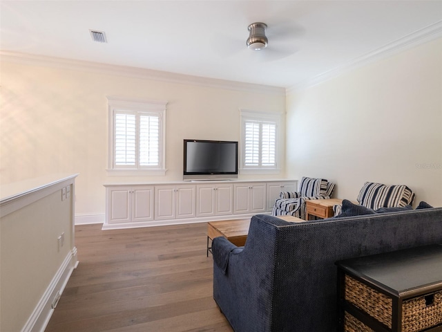 living room featuring crown molding, wood-type flooring, and ceiling fan