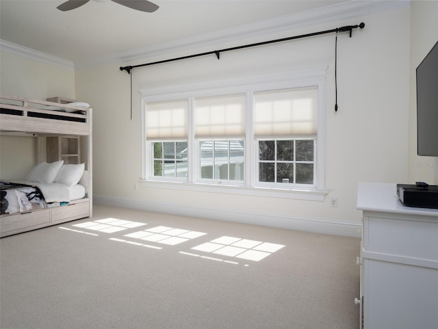 unfurnished bedroom with crown molding and light colored carpet