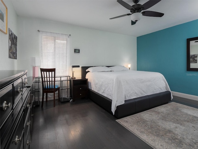 bedroom featuring dark wood-type flooring and ceiling fan