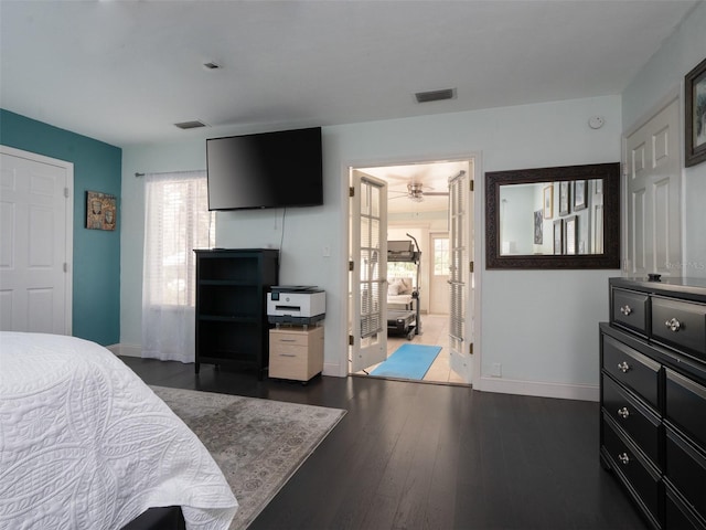 bedroom with dark wood-type flooring