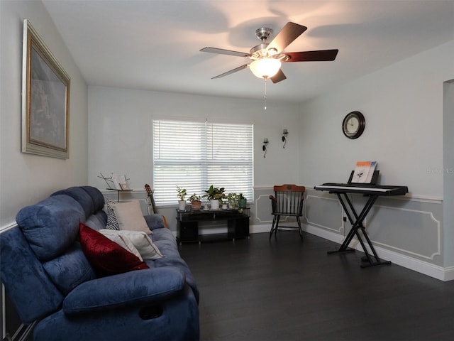 living room featuring dark hardwood / wood-style floors and ceiling fan