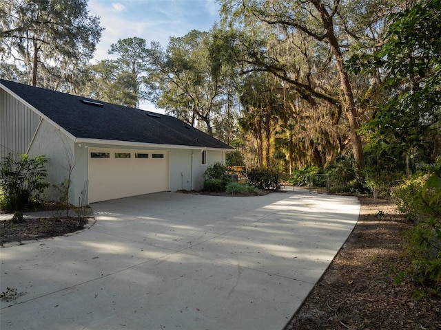 view of side of property featuring a garage