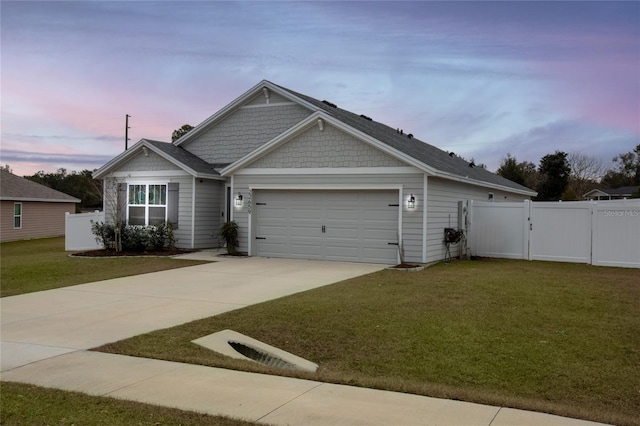 view of front of house featuring a yard and a garage