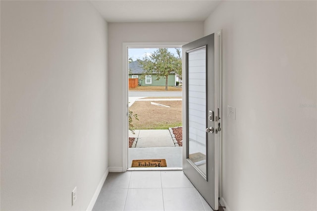 entryway with light tile patterned flooring