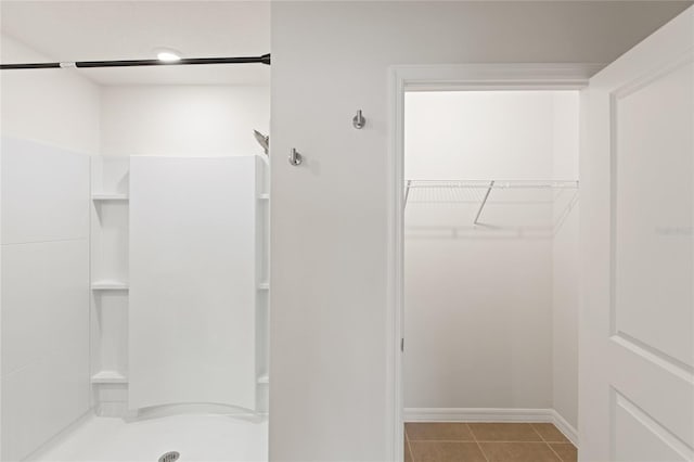 bathroom featuring tile patterned floors and walk in shower