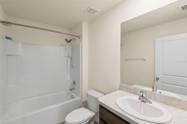 full bathroom featuring toilet, vanity, and tub / shower combination