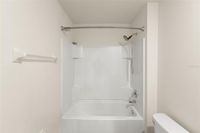 bathroom with tub / shower combination and toilet