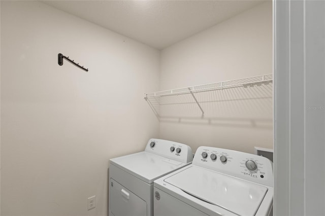 laundry room featuring washer and clothes dryer